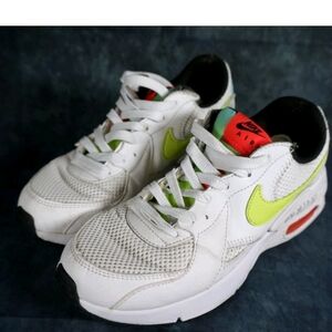 Nike White Kids Sneakers with Volt Swoosh and Red Tongue Accents